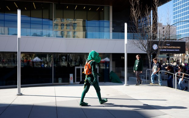A green character leaves the San Jose McEnery Convention Center at Further Confusion, also known as FurCon, in downtown San Jose, Calif., on Sunday, Jan. 18, 2026. (Nhat V. Meyer/Bay Area News Group)