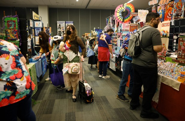 Attendees browse vendors at Further Confusion, also known as FurCon, at the San Jose McEnery Convention Center in downtown San Jose, Calif., on Sunday, Jan. 18, 2026. (Nhat V. Meyer/Bay Area News Group)