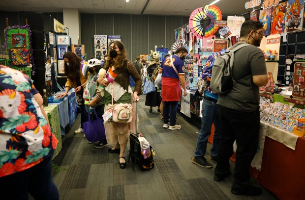 Attendees browse vendors at Further Confusion, also known as FurCon, at the San Jose McEnery Convention Center in downtown San Jose, Calif., on Sunday, Jan. 18, 2026. (Nhat V. Meyer/Bay Area News Group)
