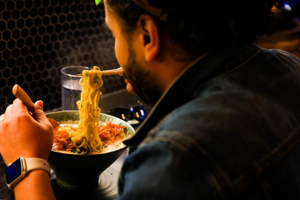 Customer Mohit Mankar, of Oakland, eats ramen soup at Mensho ramen restaurant in Oakland, Calif., on Thursday, Jan. 11, 2024. (Ray Chavez/Bay Area News Group)