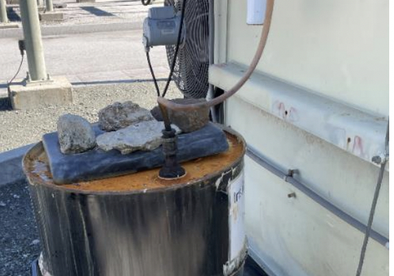 Inspectors from the California Public Utilities Commission found a jury-rigged contraption for filling leaking electrical equipment at a PG&E substation in Half Moon Bay, California, during a February 2025 audit of the facility. (California Public Utilities Commission)