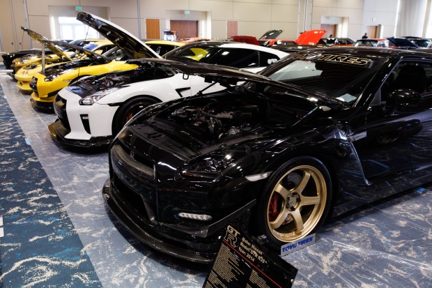Various high-performance cars including a 2014 Nissan GT-R (R35) are displayed as auto exhibitors set up for the Silicon Valley Auto Show Thursday, Jan. 8, 2026, at the Santa Clara Convention Center in Santa Clara, Calif. (Dai Sugano/Bay Area News Group)