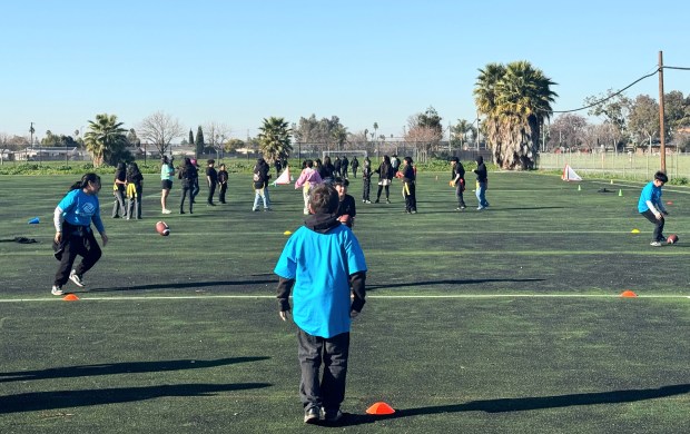 Youth members of the Boys and Girls Clubs of Silicon Valley's practice football drills at the Smythe Clubhouse in East San Jose on Wednesday, Jan. 14, 2026. (Sal Pizarro/Bay Area News Group)