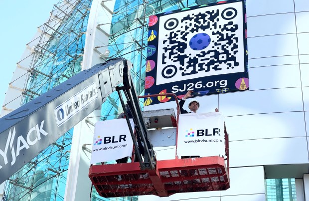 San Jose Mayor Matt Mahan takes a selfie from a crane basket at the Janet Gray Hayes Rotunda at City Hall, where a vinyl wrap was being installed on Thursday, Jan. 15, 2026, to celebrate Super Bowl LX and other sporting events happening in the Bay Area in 2026. (Sal Pizarro/Bay Area News Group)