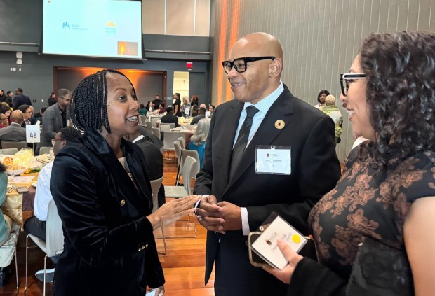 Santa Clara County Assessor Neysa Fligor, left, talks to San Jose Planning Commissioner Chuck Cantrell and his wife, Claudia Gonzalez, at the African American Community Service Agency's 46th annual Dr. Martin Luther King Jr. Luncheon, held at San Jose State University on Monday, Jan. 19, 2026. (Sal Pizarro/Bay Area News Group)