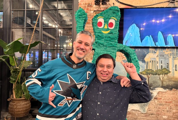 Alan "Gumby" Marques, left, poses with Mezcal owner Adolfo Gomez in front of a piñata-style sculpture of the Gumby character at a thank-you celebration for Marques, who recently stepped down as interim CEO of the San Jose Downtown Association, held Thursday, Jan. 22, 2026 at Mezcal. (Sal Pizarro/Bay Area News Group)