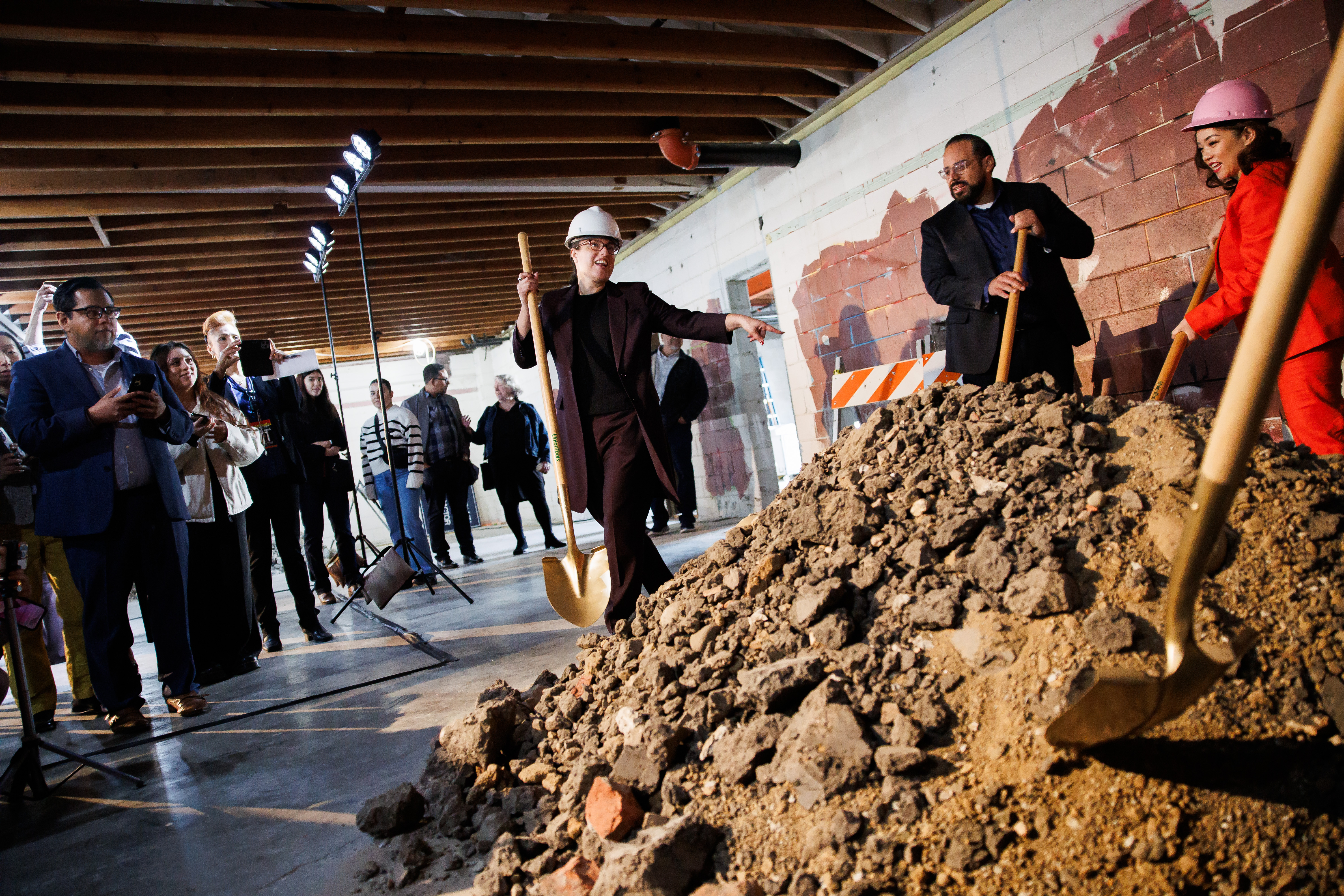 Jessica Paz-Cedillos, center, CEO of the School of Arts and...