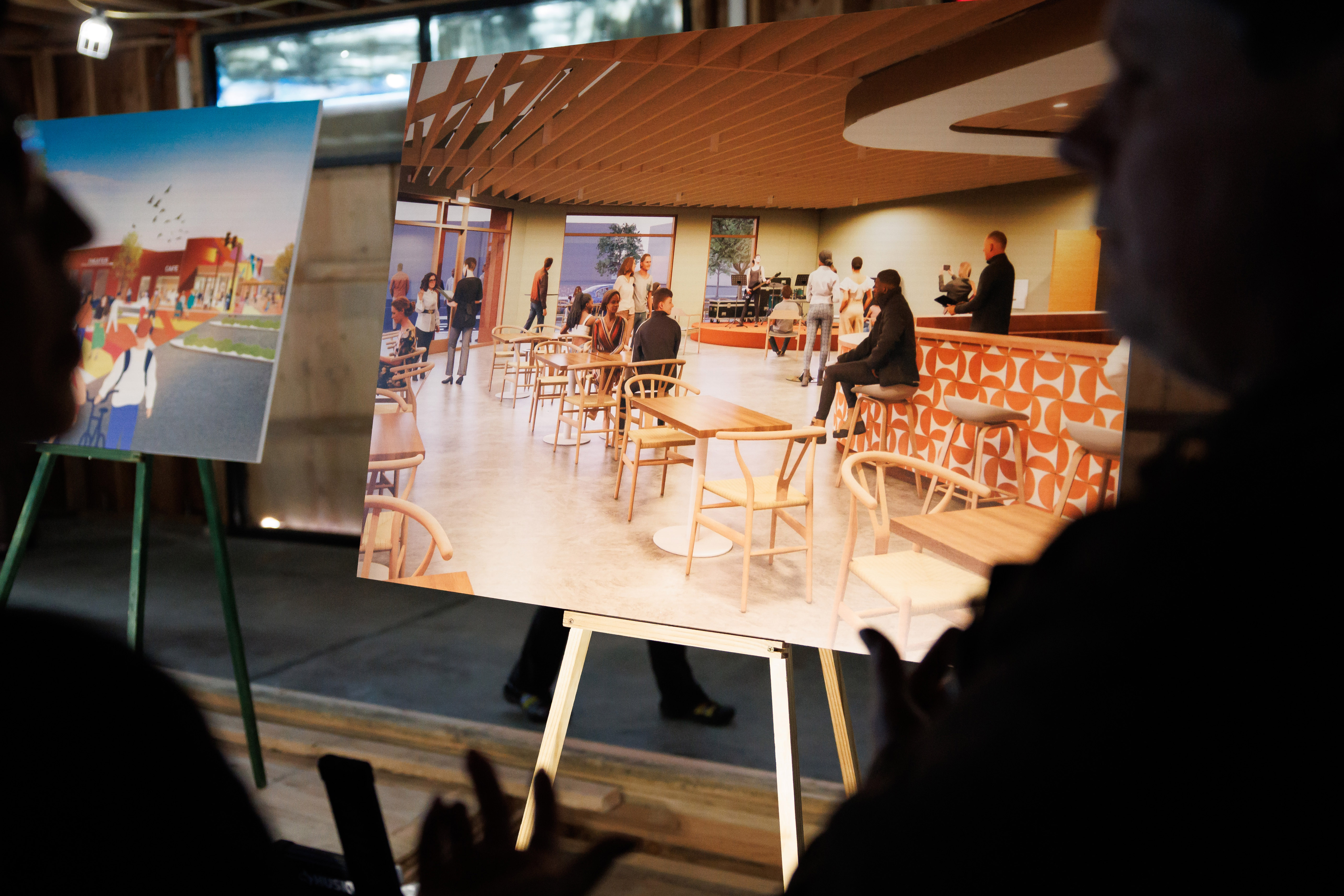 A rendering of La Placita is displayed during a community...