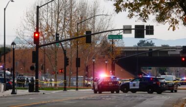 Officer wounded in downtown shootout 'doing well'