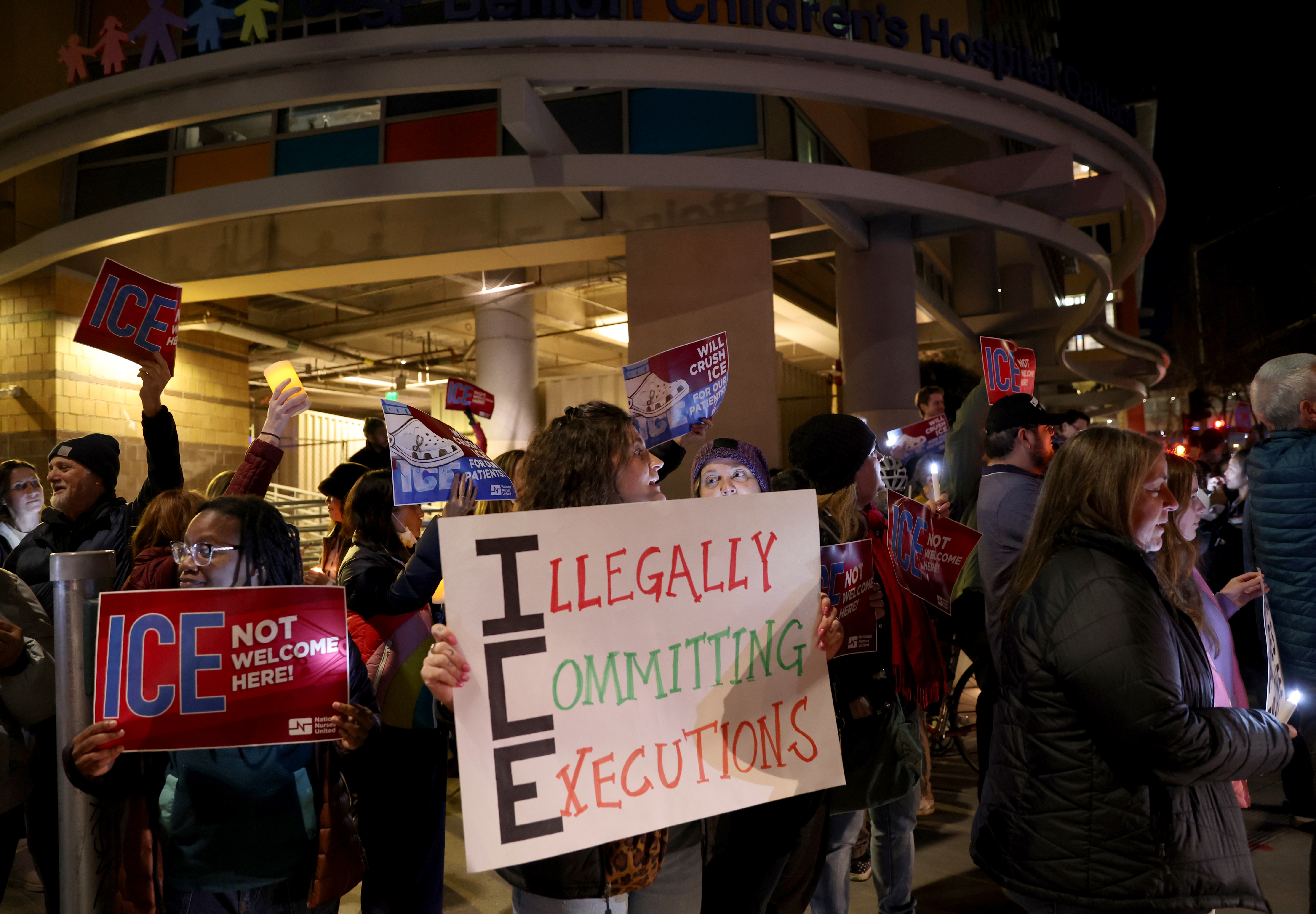 Registered nurse Hannah Pelletier, center, and others attend a protest...