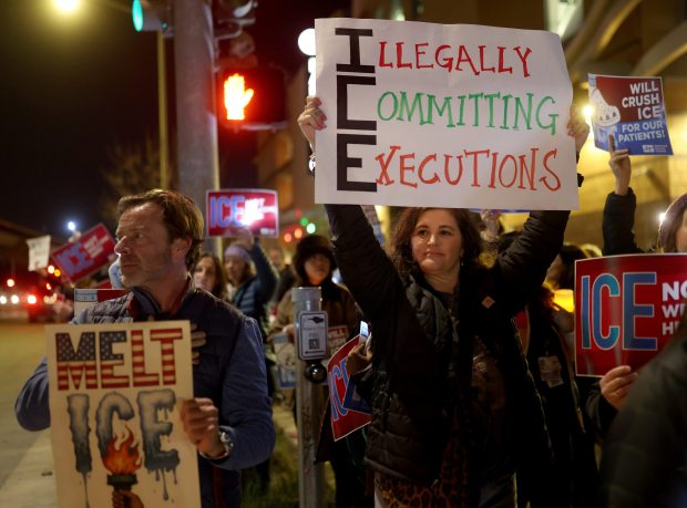 Registered nurse Hannah Pelletier, center, friend Tim McNamara, left, and others attend a protest outside of UCSF Benioff Children's Hospital Oakland in Oakland, Calif., on Monday, Jan. 26, 2026. Healthcare professionals and others are demanding justice and the abolishment of U.S. Immigration and Customs Enforcement (ICE ) in the wake of the killing of Veteran's Administration nurse Alex Pretti in Minneapolis. (Jane Tyska/Bay Area News Group)l