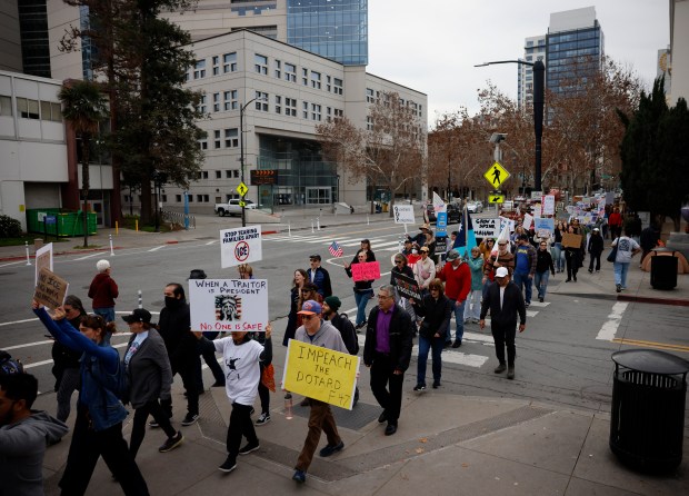 Protesters head east on East San Fernando Street as they participate in the "South Bay Free America Walkout" at San Jose City Hall in downtown San Jose, Calif., on Tuesday, Jan. 20 2026. (Nhat V. Meyer/Bay Area News Group)