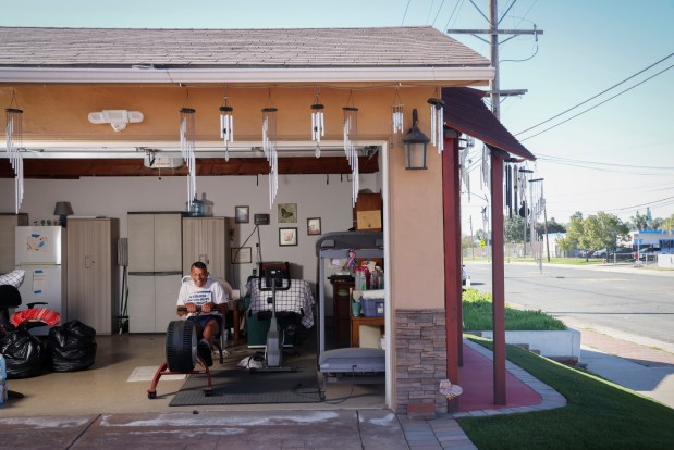 Peter Saccone, 82, works out in his garage at his home in Lemon Grove on Friday, January 16, 2026. Saccone, a former ultramarathoner and retired elementary school teacher - keeps exercising each day an is an adcocate for a living a healthy lifestyle. (Sandy Huffaker / For The San Diego Union-Tribune)