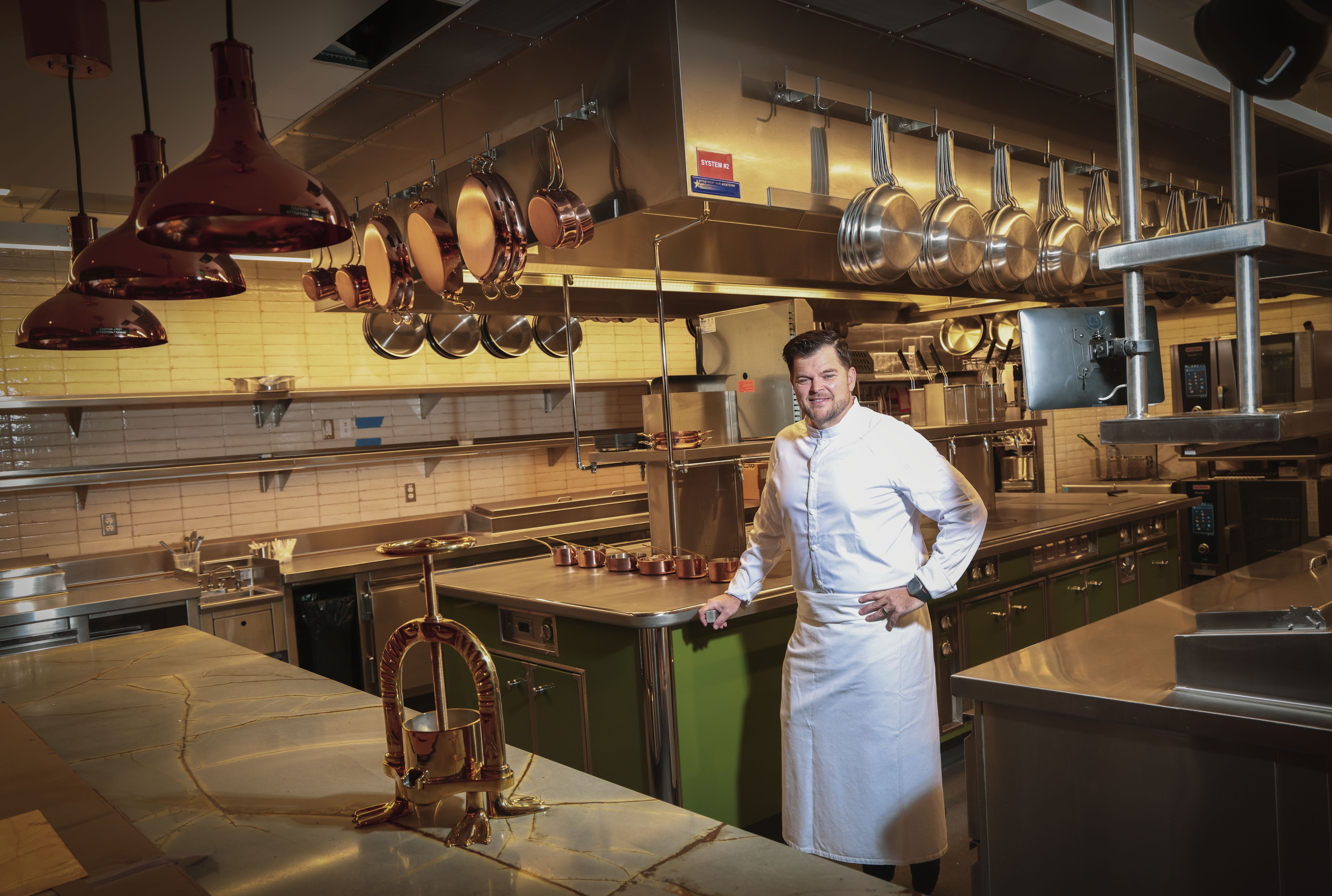 Travis Swikard, a Michelin recognized chef, stands by his Athanor...