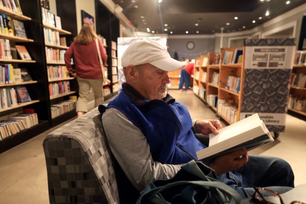 ESCONDIDO, CA - December 22, 2025: Jim Conley reads a book in the temporary Escondido Public Library located in the Mershops North County Mall in Escondido on Monday, December 22, 2025. (Hayne Palmour IV / For The San Diego Union-Tribune)