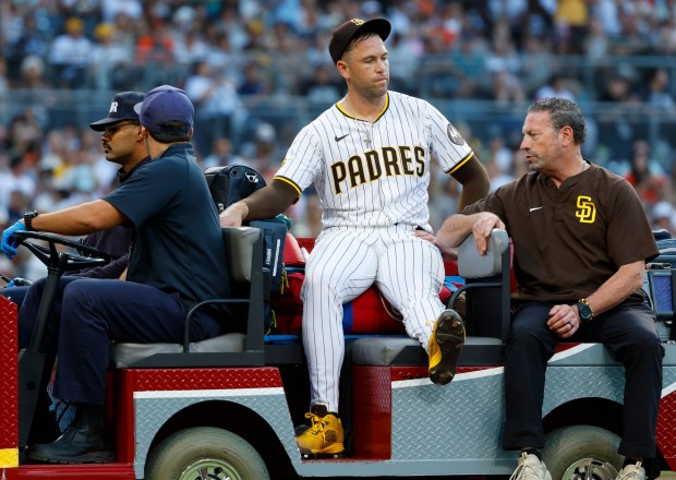 Jason Adam #40 of the San Diego Padres is carted off the field after injuring his knee in the seventh inning against the Baltimore Orioles at Petco Park on Sept. 1, 2025 in San Diego, California. (K.C. Alfred / The San Diego Union-Tribune)
