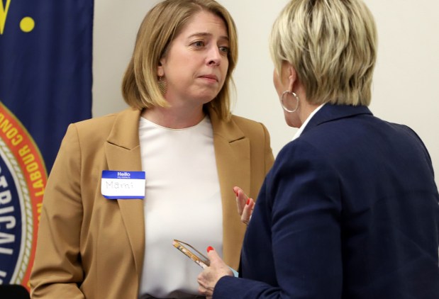 Marni von Wilpert talks with a guest during a December forum in Las Vegas for Democrats running to represent the newly drawn 48th congressional district. (James Carbone/For The San Diego Union-Tribune)