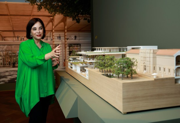 Roxana Velásquez, the Executive Director and CEO at The San Diego Museum of Art is shown with a model of an early concept design for the museum's West Wing on October 16, 2024. (K.C. Alfred / The San Diego Union-Tribune)