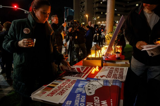 Mourners pay tribute during a candlelight vigil at the VA Hospital at UCSD in University City on Thursday, January 29, 2026.  The vigil was in honor of slain nurse Alex Pretti who was killed by ICE agents in Minneapolis. (Sandy Huffaker / For The San Diego Union-Tribune)