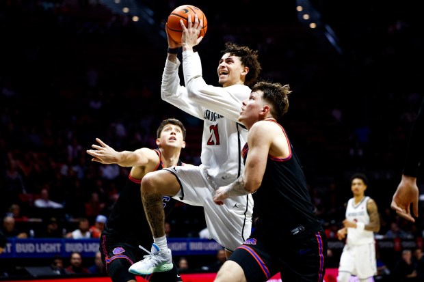 Miles Byrd #21 of San Diego State drives to the basket against Andrew Meadow #13 of Boise State during their game at Viejas Arena on Saturday, Jan. 3, 2026 in San Diego, California. (Meg McLaughlin / The San Diego Union-Tribune)