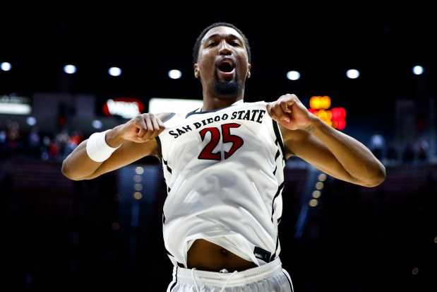 SDSU forward Jeremiah Oden celebrates after the Aztecs' defeated Boise State in triple overtime at Viejas Arena on Saturday. (Meg McLaughlin / The San Diego Union-Tribune)