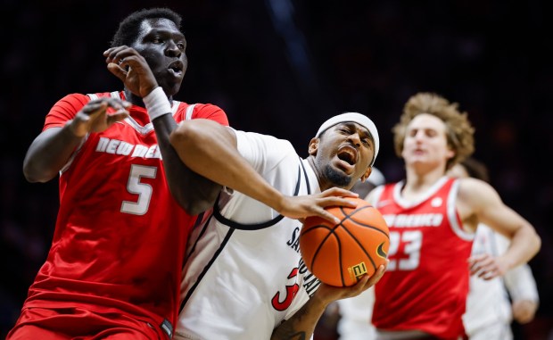 Reese Dixon-Waters #39 of San Diego State drives to the basket against Antonio Chol #5 of New Mexico during their game at Viejas Arena on Saturday, Jan. 17, 2026 in San Diego, California. (Meg McLaughlin / The San Diego Union-Tribune)
