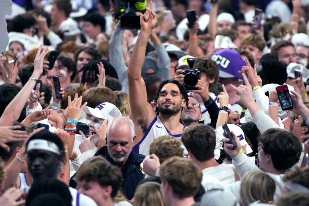 Grand Canyon forward Gabe McGlothan celebrates with fans after the team's win over San Diego State in an NCAA college basketball game Tuesday, Dec. 5, 2023, in Phoenix. (AP Photo/Rick Scuteri)