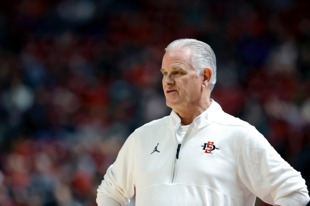SDSU coach Brian Dutcher watches during the first half of the Aztecs' 82-71 game at UNLV on Saturday afternoon. (Steve Marcus/Las Vegas Sun via AP)