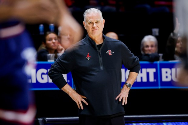 SDSU coach Brian Dutcher looks on during the Aztecs' 71-52 win against Fresno State at Viejas Arena on Saturday. (Meg McLaughlin / The San Diego Union-Tribune)
