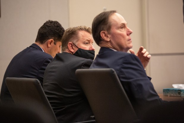 Former A3 charter school leader Jason Schrock (middle) sits with his defense team while being sentenced in court for his part in a fraud scheme at San Diego Superior Court on Friday, Sept. 10, 2021, in San Diego. (Jarrod Valliere / The San Diego Union-Tribune)