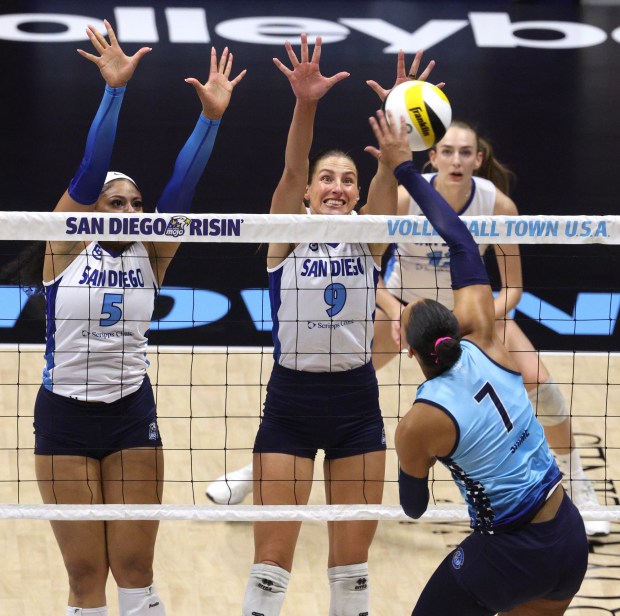 SAN DIEGO, CA - January 11, 2026: Mojo's Grace Loberg, right, and Kayla Caffey try to block a hit by Valkyries' Naya Shime during the second set at the Viejas Arena in San Diego on Sunday, January 11, 2026. (Hayne Palmour IV / For The San Diego Union-Tribune)