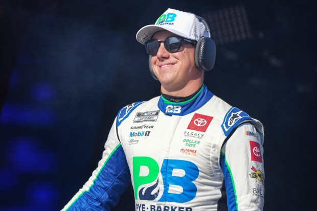 John Hunter Nemechek smiles prior to a NASCAR Cup Series auto race at Darlington Raceway, Sunday, Aug. 31, 2025, in Darlington, S.C. (AP Photo/Matt Kelley)