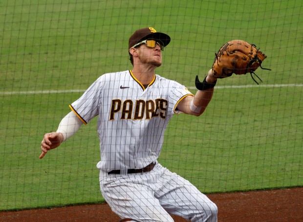 SAN DIEGO, CA - AUGUST 4: San Diego Padres' Wil Myers catches a foul ball by Colorado Rockies' Yonathan Daza at Petco Park on Thursday, August 4, 2022 in San Diego, CA. (K.C. Alfred / The San Diego Union-Tribune)