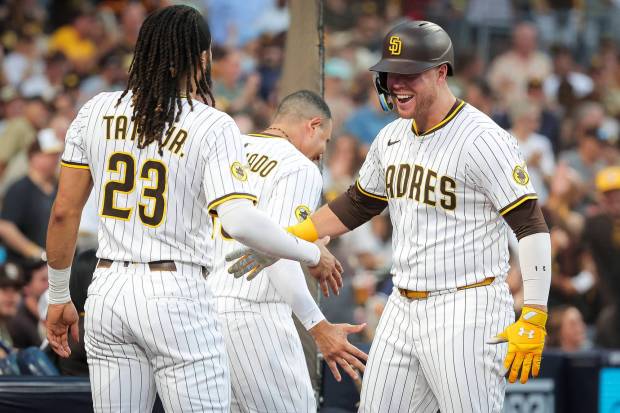 Fernando Tatis Jr. #23 and Gavin Sheets #30 of the San Diego Padres celebrate after Sheets' home run against the San Francisco Giants during the second inning at Petco Park on Wednesday, Aug. 20, 2025 in San Diego, CA. (Meg McLaughlin / The San Diego Union-Tribune)