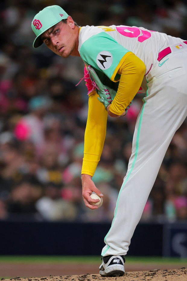 Ron Marinaccio #97 of the San Diego Padres looks over before pitching against the Colorado Rockies during the seventh inning at Petco Park on Friday, Sept. 12, 2025 in San Diego, California. (Meg McLaughlin / The San Diego Union-Tribune)