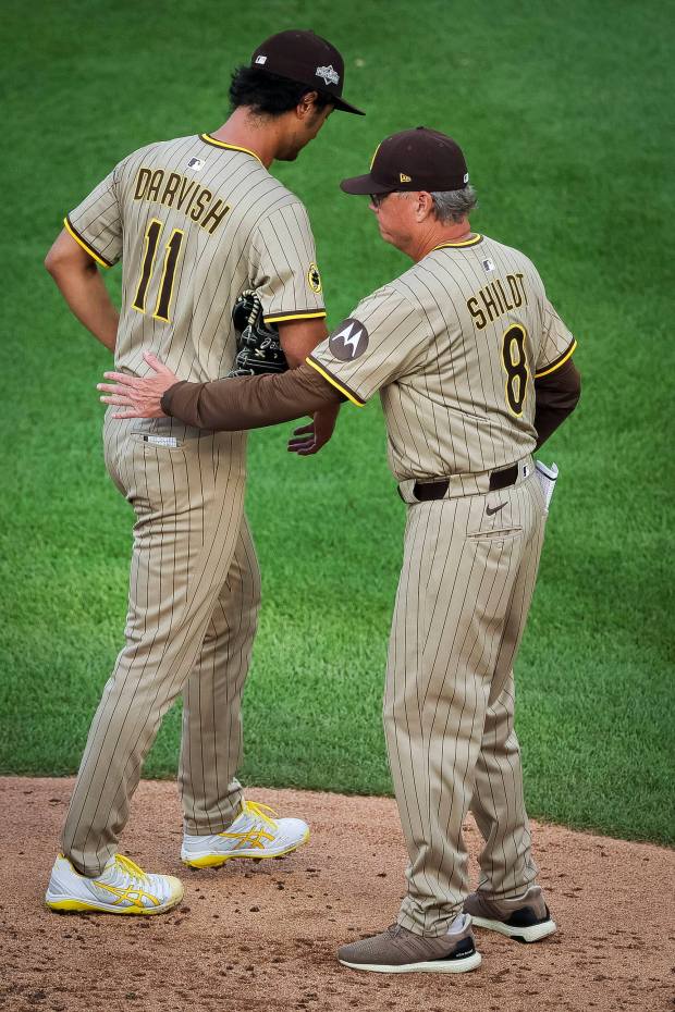 Mike Shildt #8 pulls Yu Darvish #11 of the San Diego Padres from the game against the Chicago Cubs during Game 3 of the NL Wild Card Series at Wrigley Field on Thursday, Oct. 2, 2025 in Chicago, Illinois. (Meg McLaughlin / The San Diego Union-Tribune)