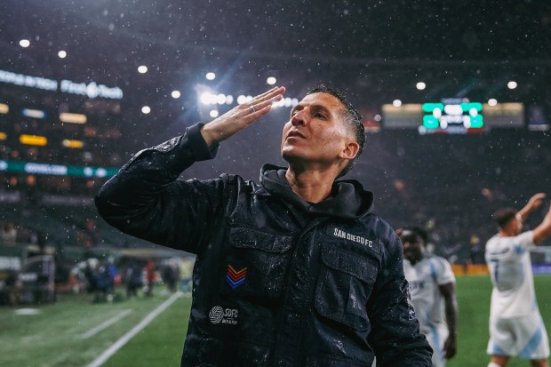 San Diego FC coach Mikey Varas blows a kiss to thre crowd after his club beat the Portland Timbers and secured the No. 1 seed in Major League Soccer's Western Conference playoffs. (Brandon Bullas, San Diego FC)