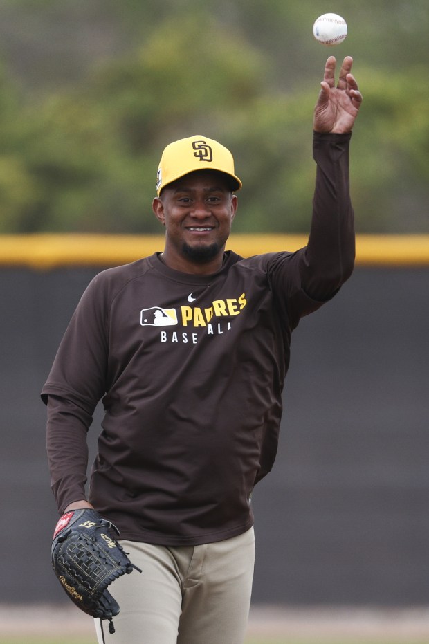 Wandy Peralta smiles as he tosses a ball back during Padres spring training workouts at the Peoria Sports Complex on Wednesday, Feb. 12, 2025 in Peoria, Ariz.. (Meg McLaughlin / The San Diego Union-Tribune)
