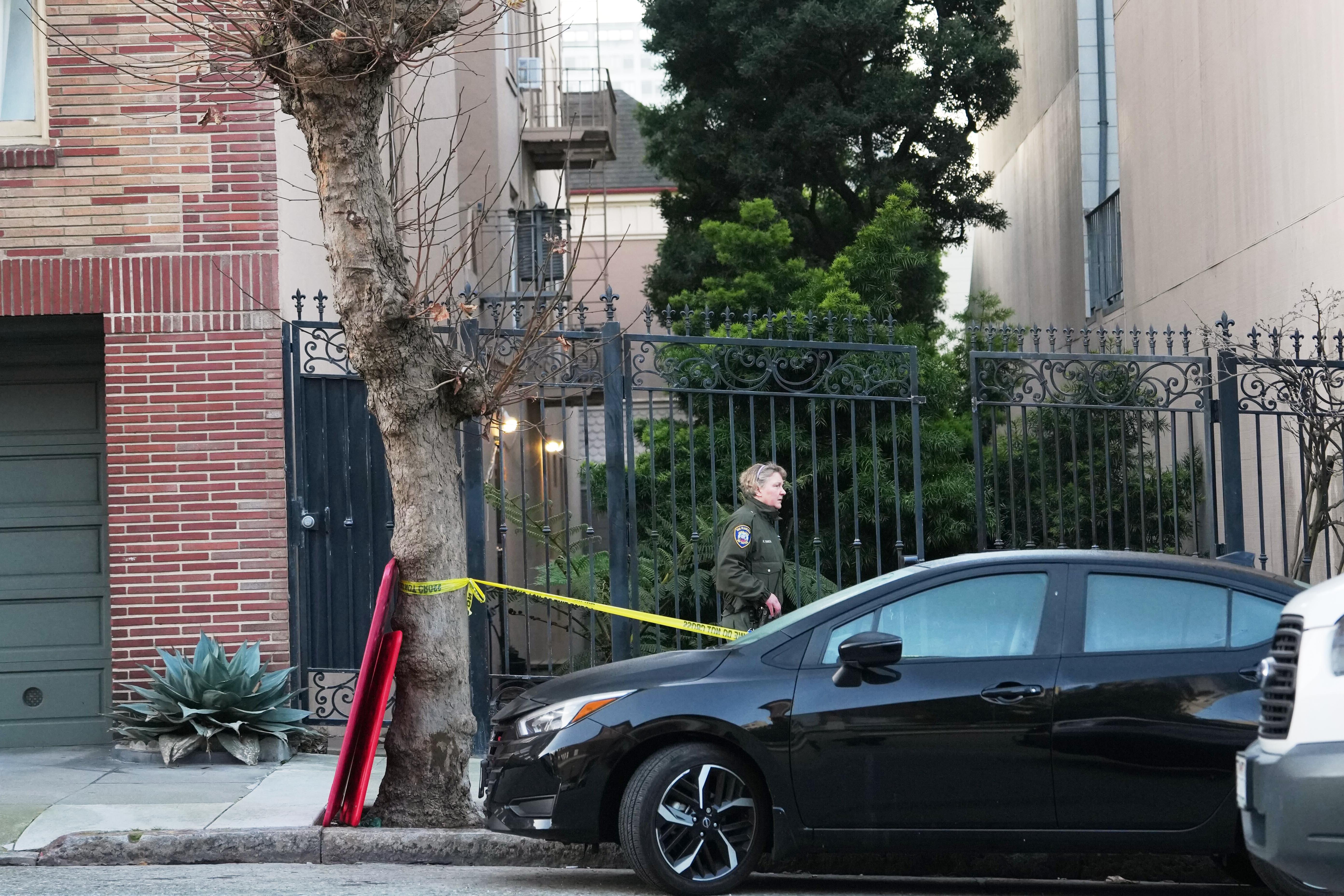 An animal control officer stands in front where a mountain...