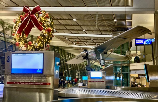 A replica of the Spirit of St. Louis hovers over the baggage claim area in Terminal 2 at San Diego International Airport, formerly called Lindbergh Field. (Eric DuVall)