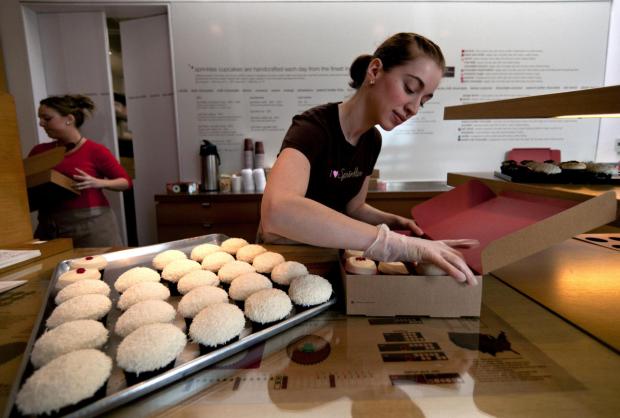 Sara Cebulski arranges a custom box of cupcakes at Sprinkles