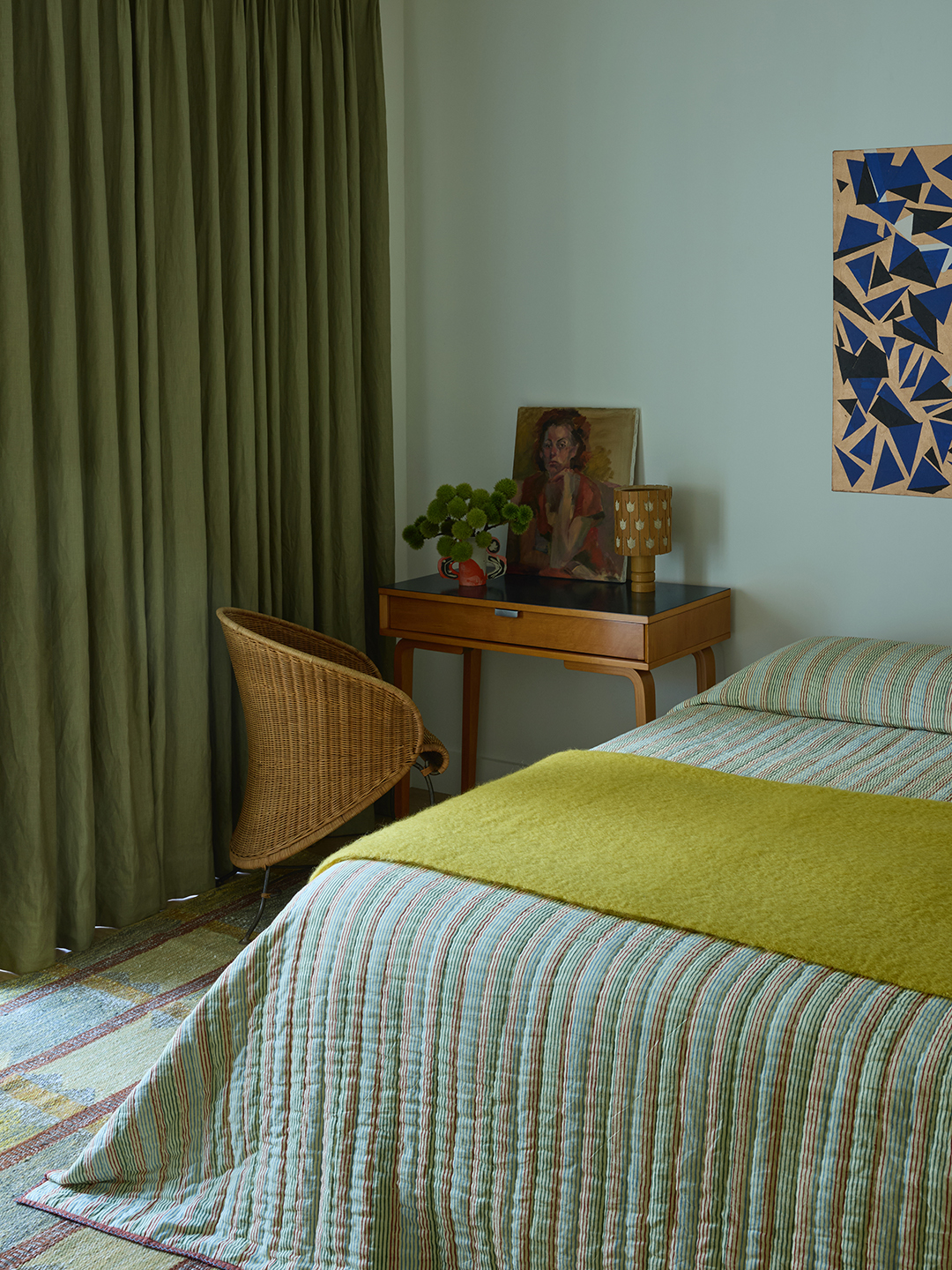 bedroom with wood desk and yellow bedspread
