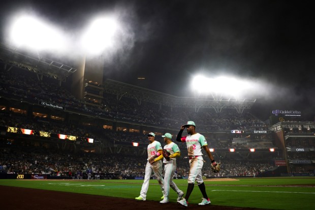 San Diego Padres third baseman Manny Machado, second baseman Jose Iglesias, and second baseman Xander Bogaerts walk back to the dugout during the eighth inning against the Colorado Rockies at Petco Park on Friday, April 11, 2025 in San Diego, CA. (Meg McLaughlin / The San Diego Union-Tribune)