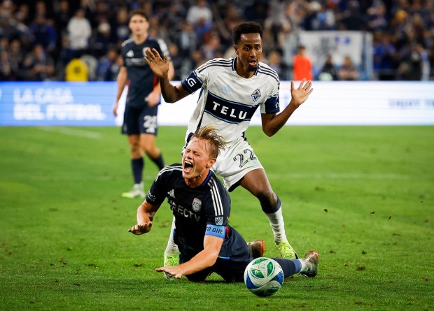 San Diego FC defender Jeppe Tverskov #6 reacts as he falls against Vancouver Whitecaps midfielder Ali Ahmed #22 during the MLS Cup Western Conference Final at Snapdragon Stadium on Saturday, Nov. 29, 2025 in San Diego, California. (Meg McLaughlin / The San Diego Union-Tribune)
