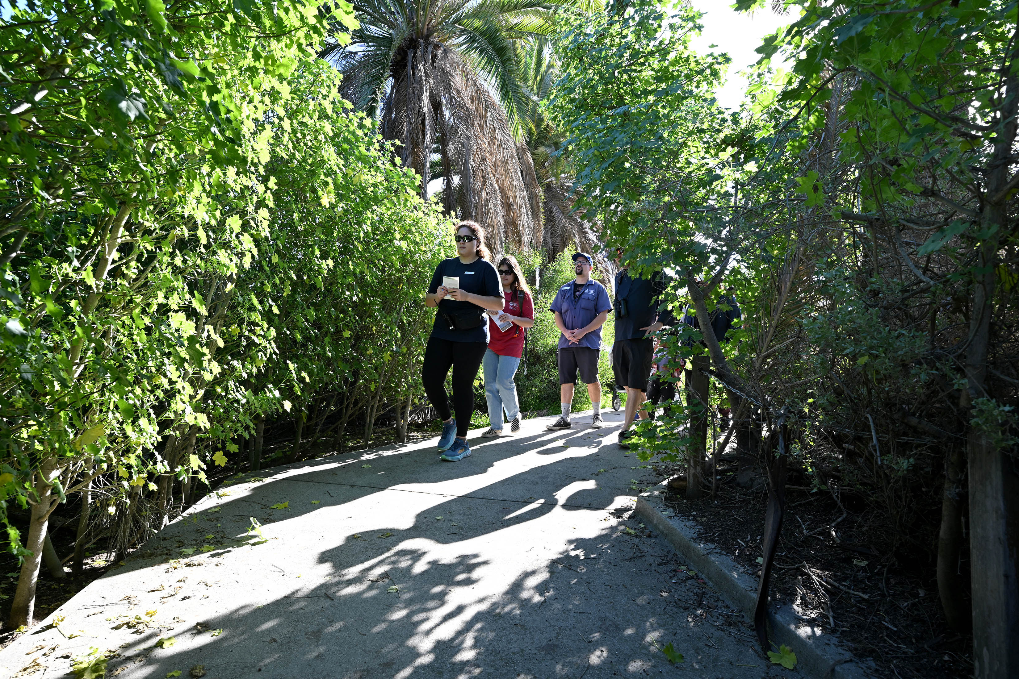 Aquarium educators Lani Brand and Rachel Ichimaru guide participants on...