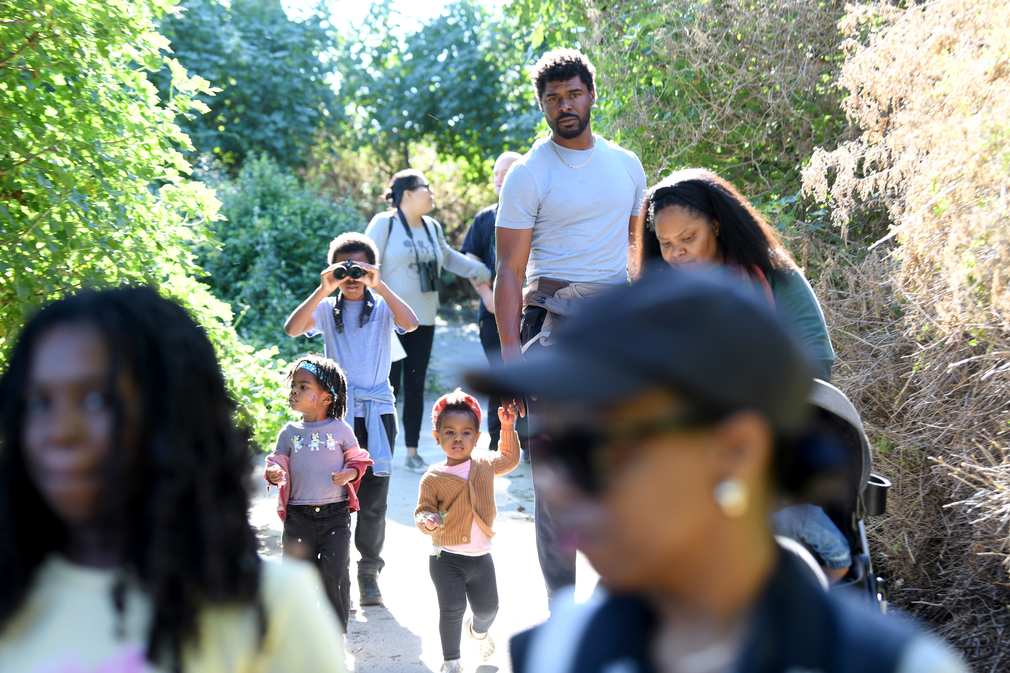 Aquarium educators guide participants on a Cabrillo Beach walk through...