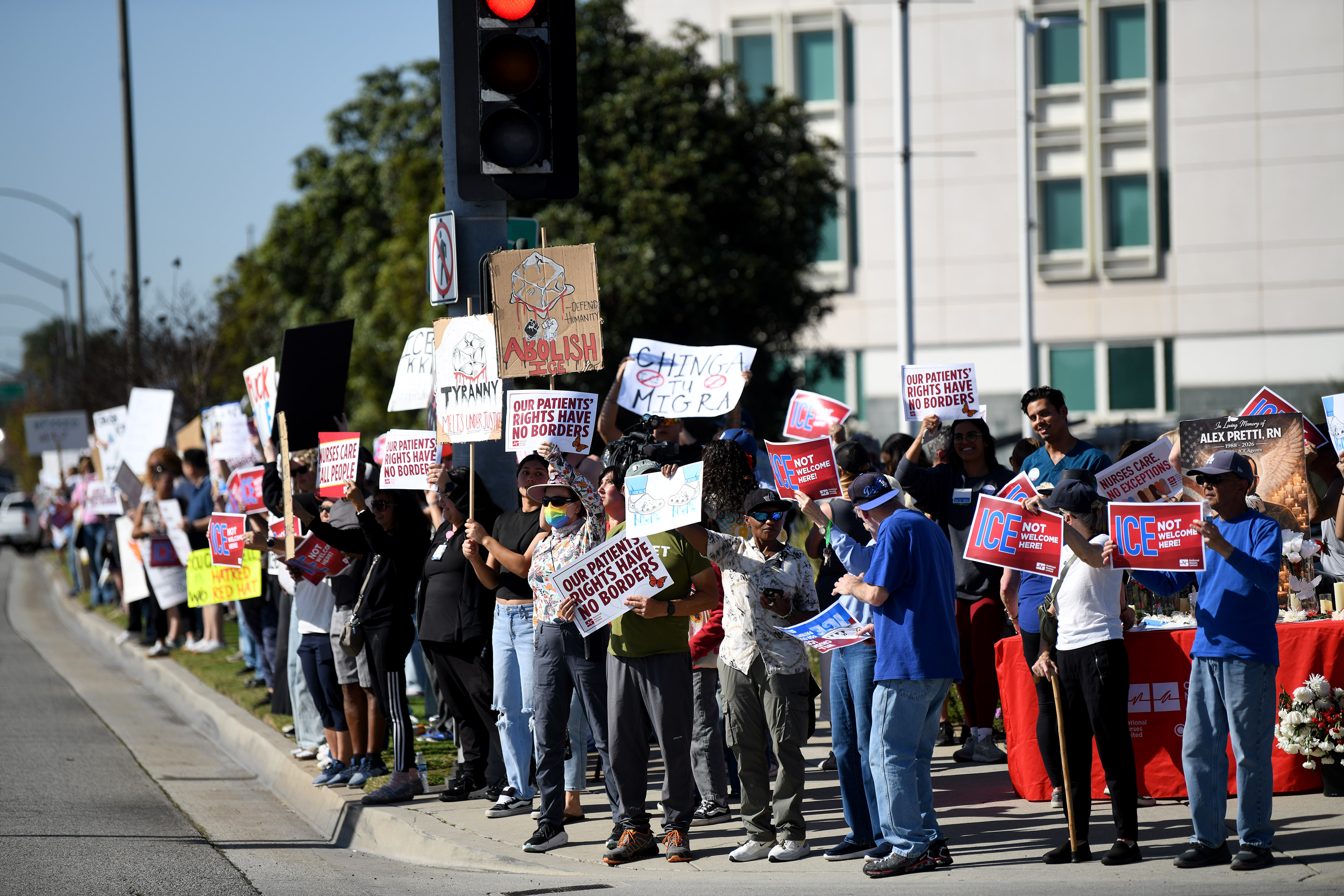 Nurses and community members stage a walk-out to protest in...