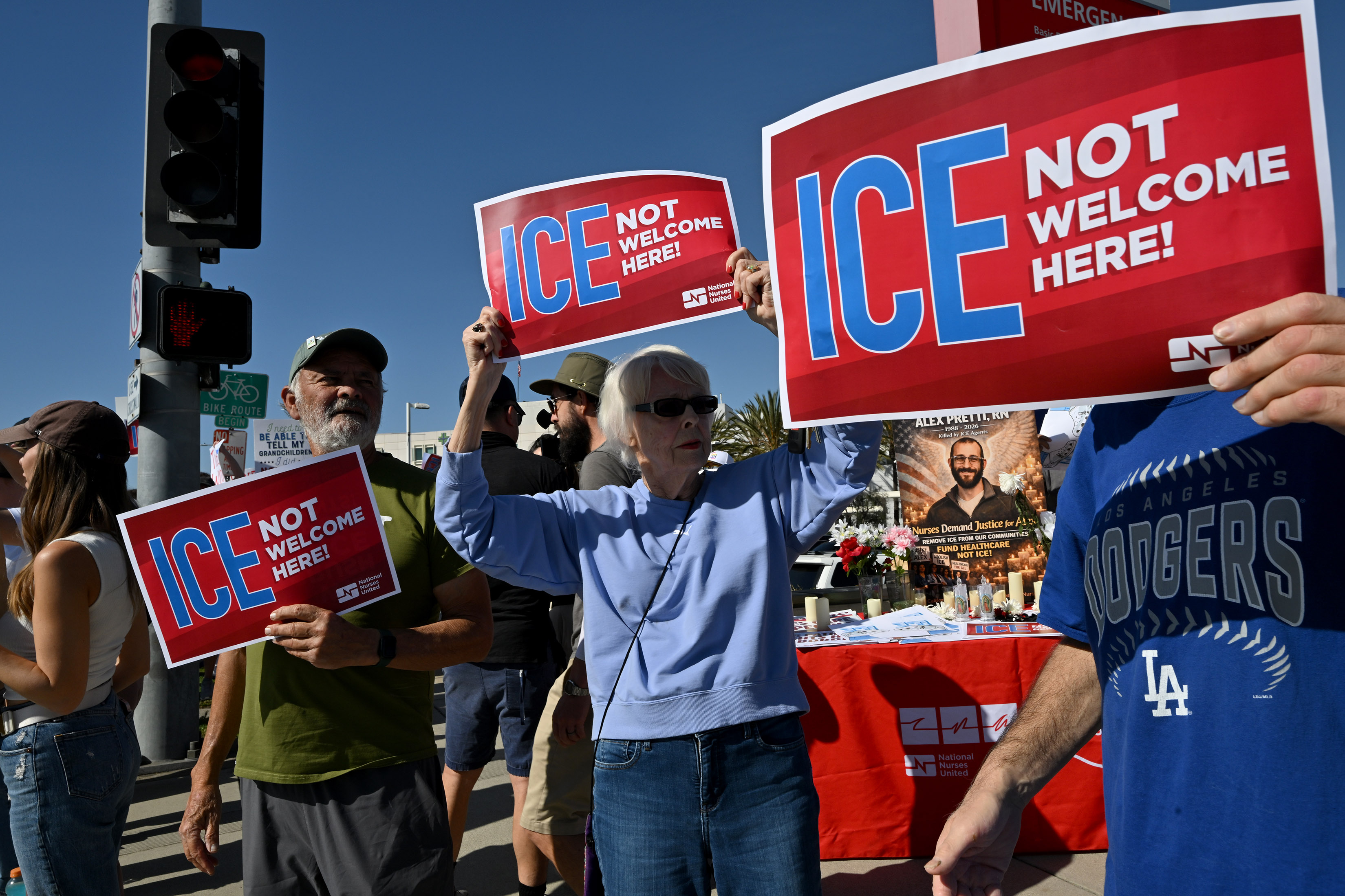 Nurses and community members stage a walk-out to protest in...