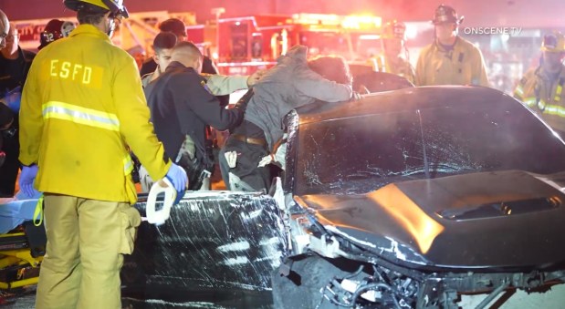California Highway Patrol officers arrest a man who they say led them on a pursuit early Jan. 25, 2026, before crashing off the 105 Freeway near Los Angeles International Airport. (Photo by OnScene.TV)