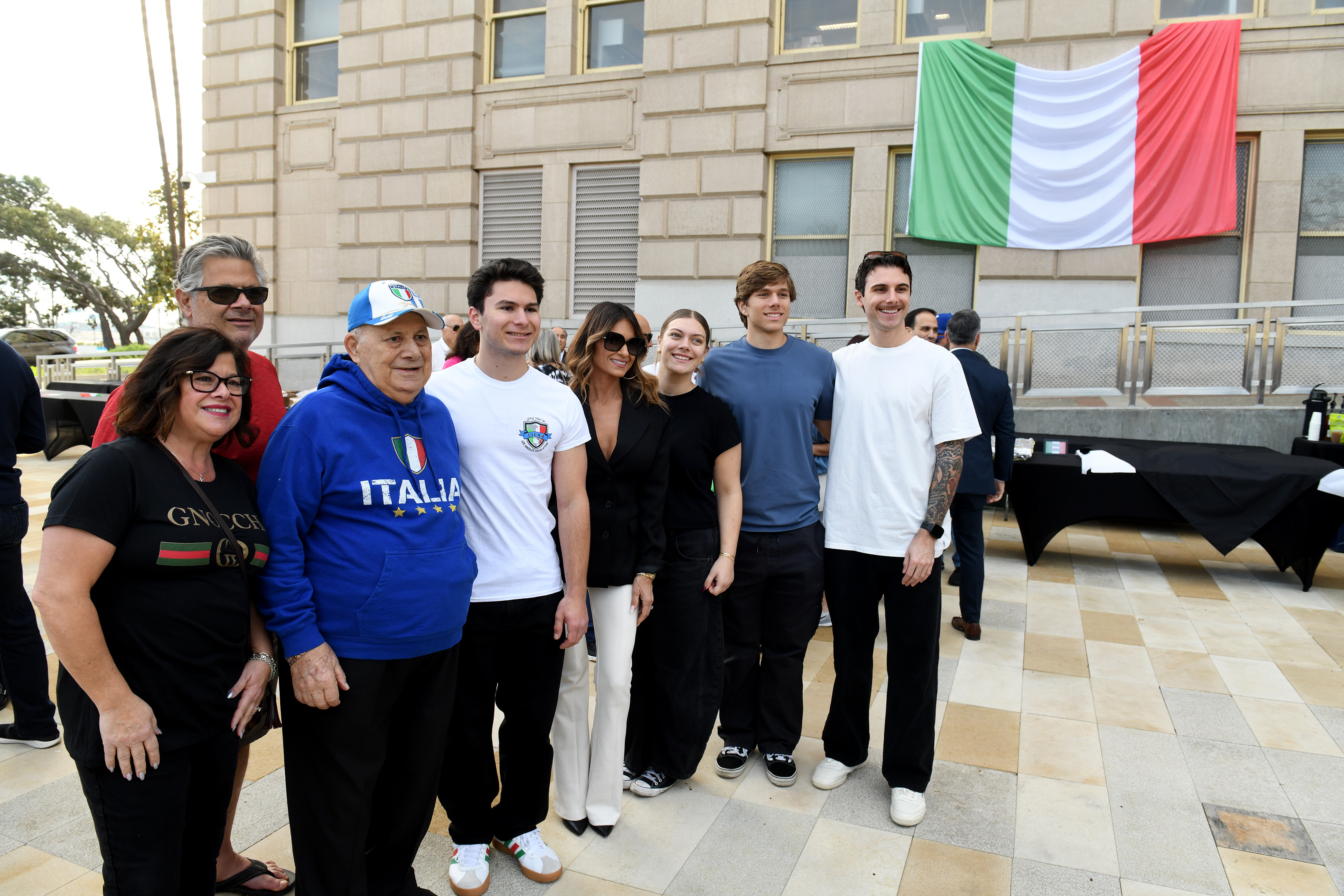 John DeGirolamo and his family come together for a ribbon-cutting...